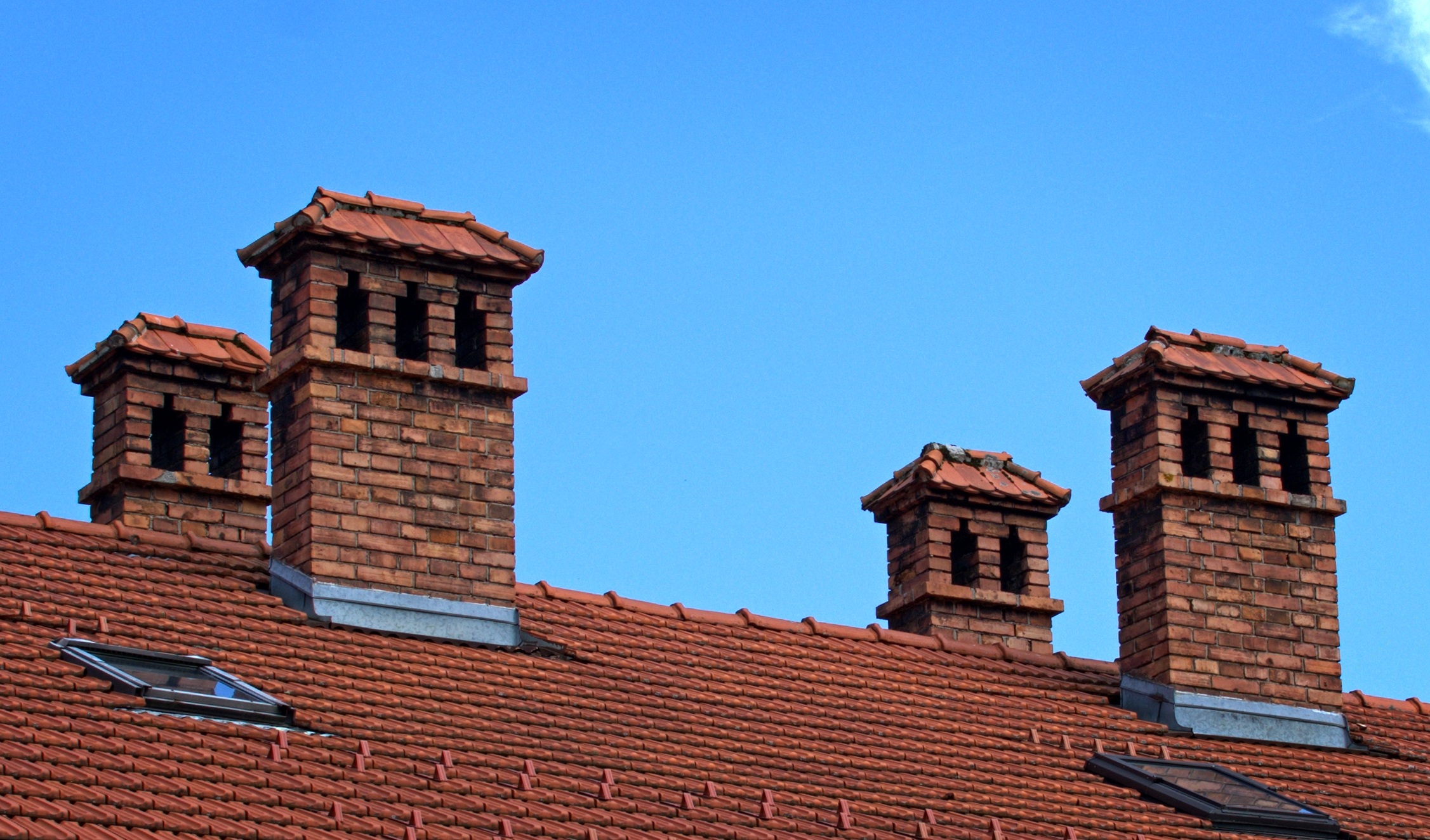 Free image/jpeg Resolution: 2253x1324, File size: 849Kb, Four brick chimneys on the roof